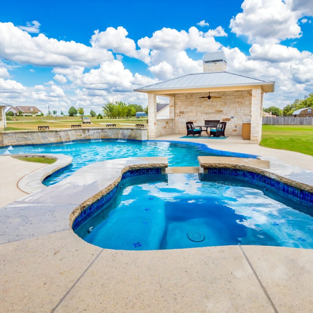 pool with a gazebo built into the walking path