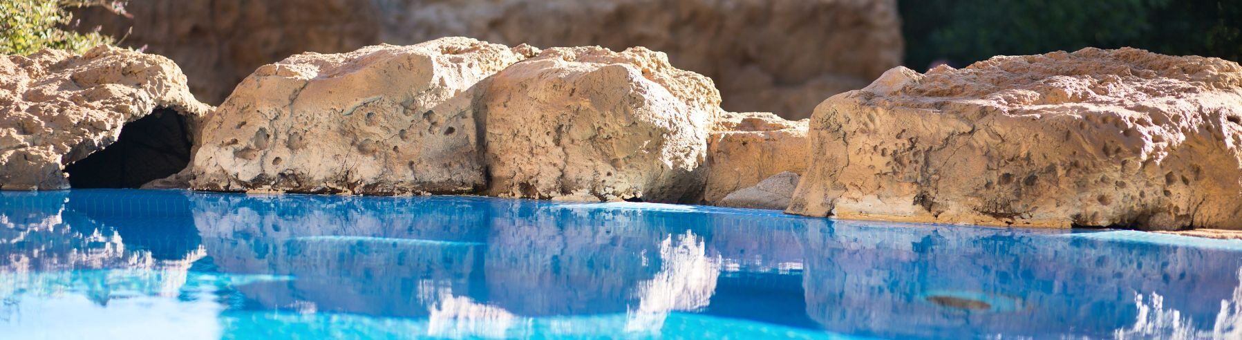 rocks surrounding a pool